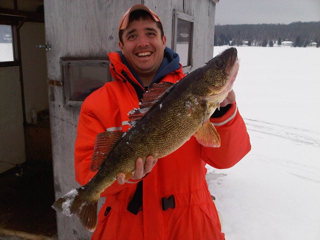 Walleye Jan 2012.jpg - Tim proudly showing off his Walleye while Ice Fishing
